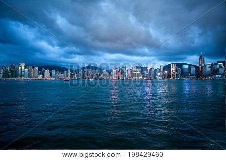 HONG KONG â JULY 18, 2017: Victoria Harbor view with Hong Kong skyline and urban skyscrapers