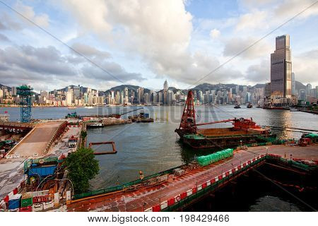 HONG KONG â JULY 18, 2017: Victoria Harbor view with Hong Kong skyline and urban skyscrapers