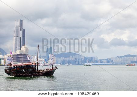 HONG KONG â JULY 18, 2017: Victoria Harbor view with Hong Kong skyline and urban skyscrapers