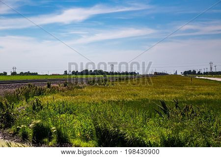 A train hauls freight on a railroad across the midwest near Lexington Nebraska.