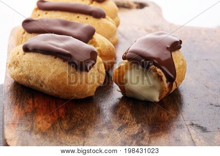 Traditional French Dessert. Eclair With Chocolate Icing. Pastery Concept