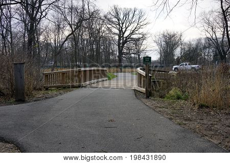 A sign marks the end of the paved trail in the Hammel Woods Forest Preserve in Shorewood, Illinois.