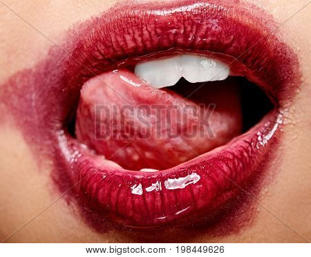 Sexy Lips With The Smeared Lipstick Tongue Lick The Teeth . Open Mouth With White Teeth. Cosmetology