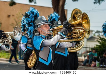 Marching band female baritone player in the number one position.