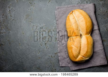 Traditional chilean bread marraqueta on wooden background