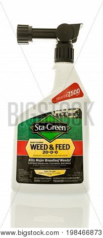 Winneconne WI - 5 August 2017: A bottle Sta-Green weed and feed on an isolated background.