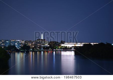 Panoramic photo of Washington, D.C. skyline at night.