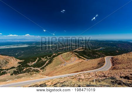 Pikes Peak is the highest summit of the southern Front Range of the Rocky Mountains. The ultra-prominent fourteener is located in Pike National Forest 12 miles west of downtown Colorado Springs. The mountain is named in honor of American explorer Zebulon