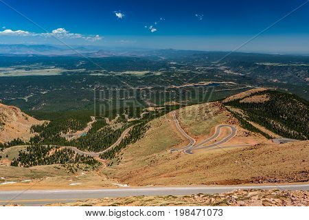 Pikes Peak is the highest summit of the southern Front Range of the Rocky Mountains. The ultra-prominent fourteener is located in Pike National Forest 12 miles west of downtown Colorado Springs. The mountain is named in honor of American explorer Zebulon