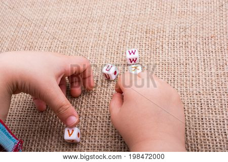 Colorful Alphabet Letter Cubes In Hand