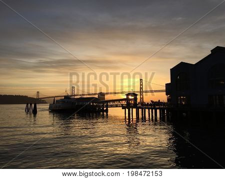 A San Francisco Pier and Bay Bridge at Dawn