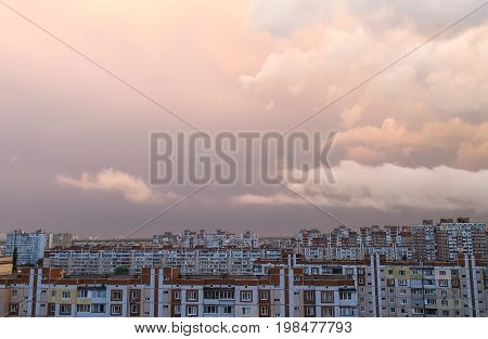Sunset with clouds after the rain over dormitory area