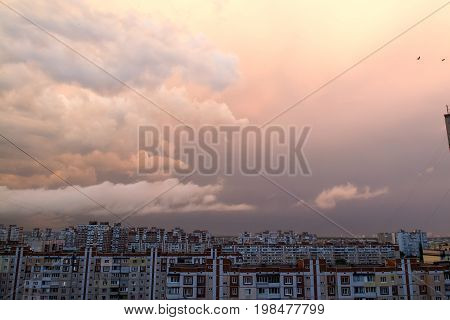 Sunset with clouds after the rain over dormitory area