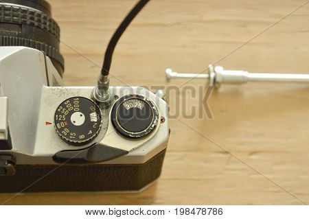 classic shutter cable released operated on film camera ready to shooting