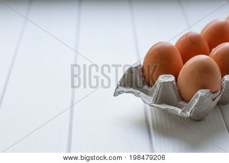 Eggs in the paper tray package on white background.