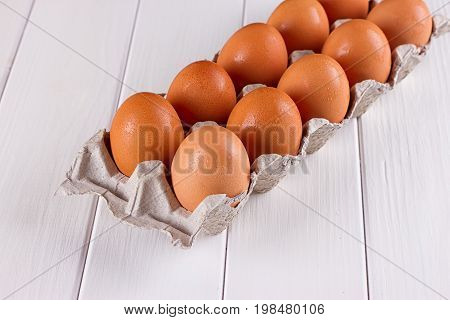 Eggs in the paper tray package on white background.