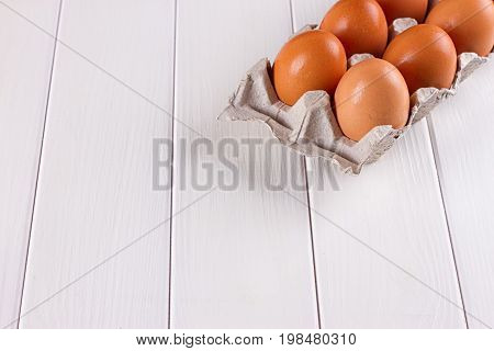 Eggs in the paper tray package on white background.