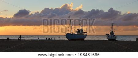 Fishing boats at sunset. Slettestrand Denmark. Summer scene.