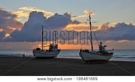 Fishing boats at the Slettestrand Jammerbugten. Sunset at the west coast of Denmark.
