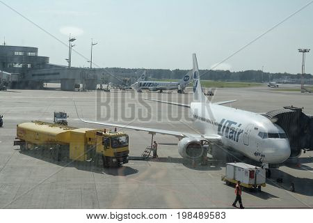 Mosow, Russia - July, 2017: airport Vnukovo, airplane UTair, Serviced by workers before departure summer day