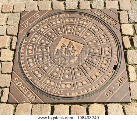 Nykøbing. June-14-2017. Manhole cower in the city of Nykøbing on the island of Falster. Denmark