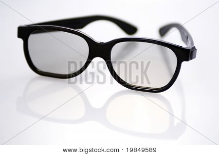 A pair of black rimmed glasses shot in very shallow DOF