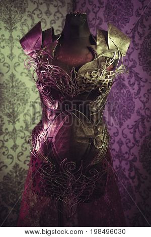 Armor of woman Strong metal breastplate handmade in gold with gothic shapes and fine steel strands