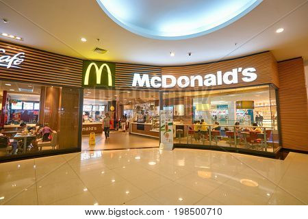 SHENZHEN, CHINA - CIRCA OCTOBER, 2015: McDonald's restaurant and McCafe in Shenzhen. McDonald's is an American hamburger and fast food restaurant chain.