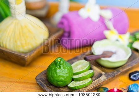 Spa massage compress balls herbal ball on the wooden with treaments spa Thailand soft and select focus.