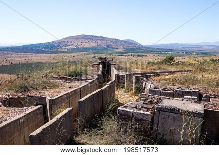 Old abandoned trenches from the time of the Yom Kippur War on the Golan Heights near the border with Syria in Israel