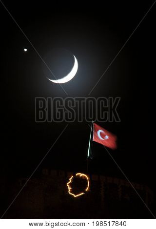 Star, moon and Turkish flag are together in the night