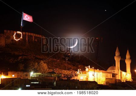 Star, moon and Turkish flag are together at night