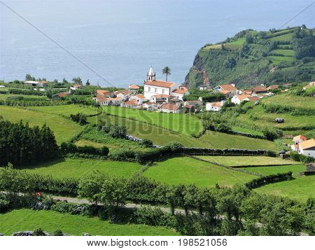Lajes das Flores village seen behind a patchwork of fields, Flores island, The Azores