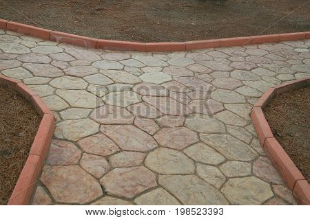 Brown and beige cobbles different sizes background texture