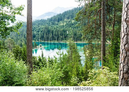 Caumasee in Switzerland lake with turquoise water for hiking and swimming
