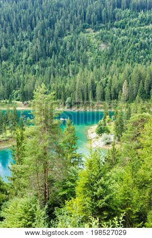 Caumasee in Switzerland lake with turquoise water for hiking and swimming