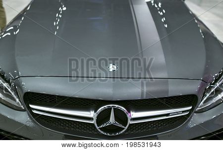 Sankt-Petersburg Russia July 21 2017: Front view of a Mercedes Benz C 63s coupe 2017. Front Headlight. Dark Matt colour .Car exterior details. Photo Taken at Royal Auto Show July 21