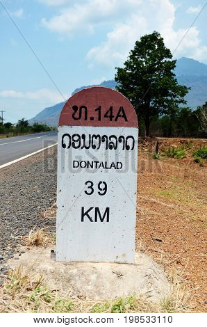 Old Milestone on the road information distance Dontalad with Pakse on May 1 2015 in Champasak Laos
