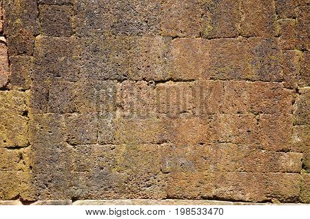 Ancient floor laterite stone background at archaeological site Wat Phu or Vat Phou 10th century is a ruined Khmer Hindu temple in Champasak Laos