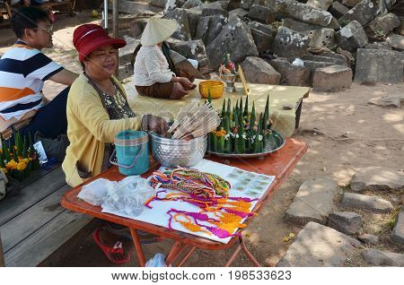 Laos Woman Sale Sacrificial Offering Made From Banana Leaf And Flower For People Praying To Buddha A