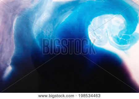 Abstract artistic background of colorful splotch similar to sea wave. Watercolor gradient from dark to light blue and purple shading off