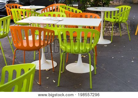 Old fashioned cafe terrace. Tables and wicker chairs in a cafe.