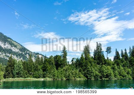 crestasee with mountain and forest view in flims switzerland