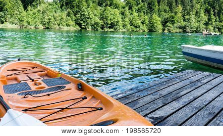 boats on crestasee lake ready to use in flims switzerland