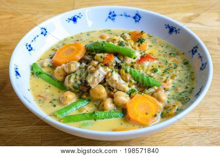 Stew or soup with healthy vegetables like chili beans carrots and lentils