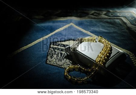 Holy Quran With Beads On A Prayer Mat, Muslim Tasbih Is A String Of Prayer Beads Which Is Traditiona