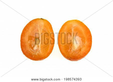 The Nagami Cumquat Fortunella margarita looks like a tiny orange with an oval shape sweet oily skin quite sour inside and orange colour.