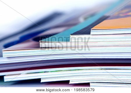 stack of the colorful magazines extreamly DOF