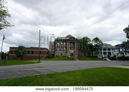CADILLAC, MICHIGAN / UNITED STATES -  MAY 31, 2017: The historic Wexford County Courthouse, with its impressive columns, is near downtown Cadillac.