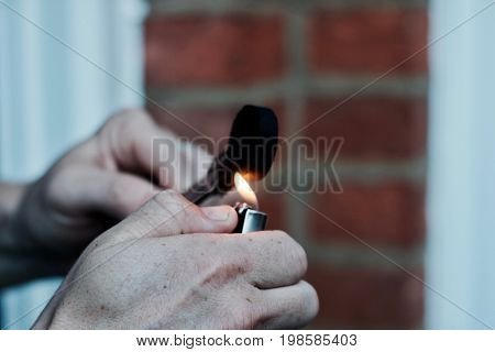 Man Burning Sisha Carbon